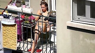 Candid Girl Sunbathing On The Balcony