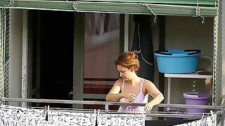 Milf Neighbor Showing Downblouse On The Balcony