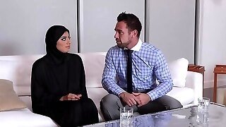 Ella Knox Is Wearing A Head Scarf And A Long, Black Outfit While Fucking Her Client