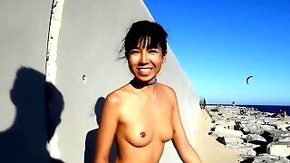Skinny Babe Is Doing Some Very Naughty Stuff On The Beach, In The Middle Of The Day