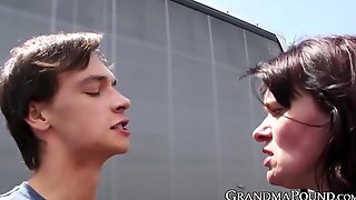 Busty Grandma Disciplines Young Cock With Public Handjob
