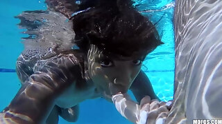 Ebony Young Girl Gets Frisky In The Pool And Takes A White Cock